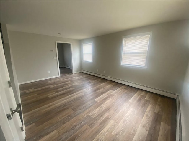 951 Main St, West Warwick, RI 02893 - spare room with baseboard heating and wood finished floors