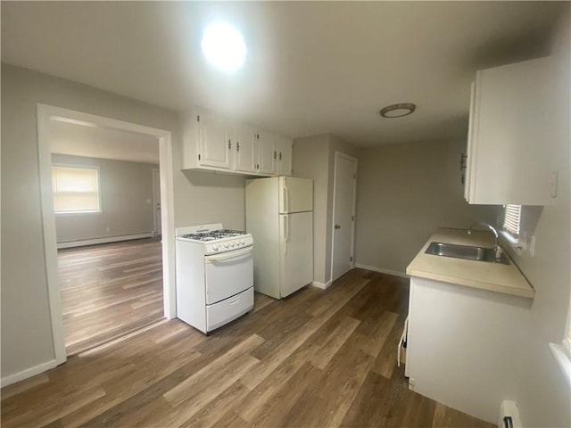 951 Main St, West Warwick, RI 02893 - kitchen featuring white appliances, dark wood-type flooring, white cabinetry, light countertops, and a baseboard radiator
