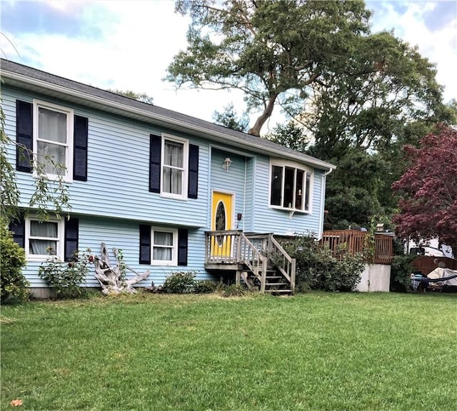 raised ranch featuring a front yard