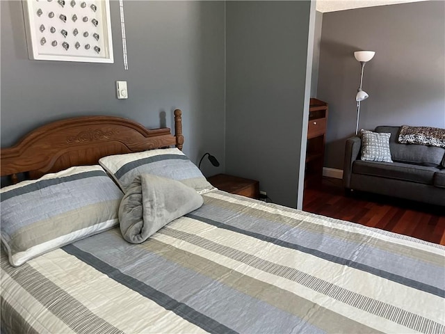 bedroom with wood finished floors