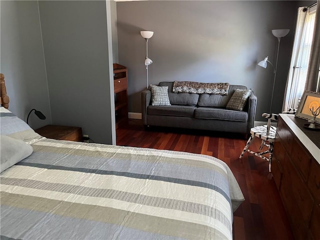 bedroom with wood finished floors