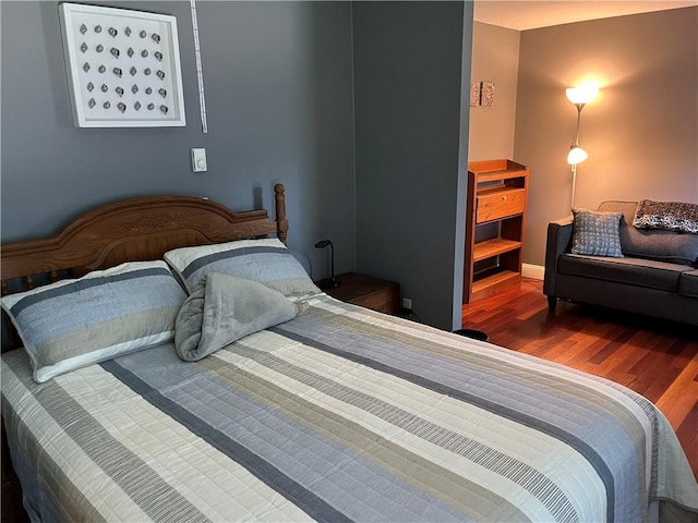 bedroom featuring wood finished floors