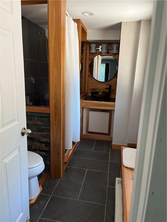 full bath with vanity, tile patterned floors, and toilet