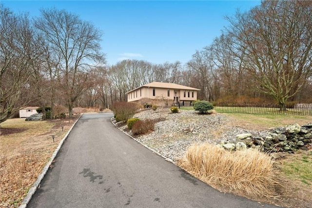 ranch-style home with fence