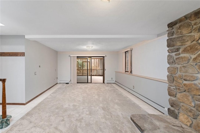 interior space featuring baseboard heating, a baseboard radiator, carpet flooring, and baseboards