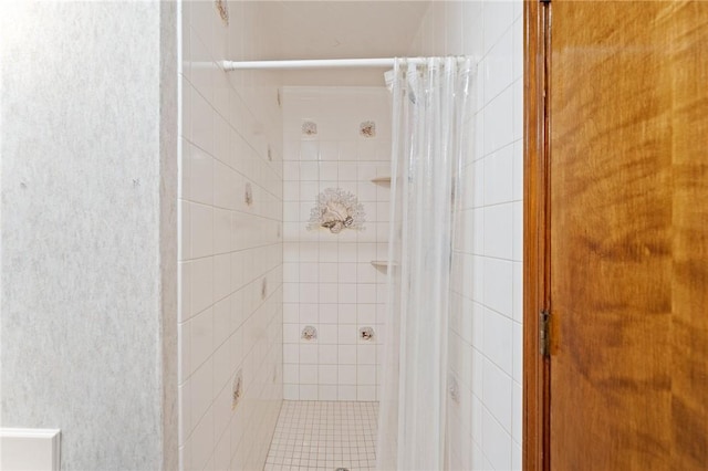 full bath featuring a shower stall