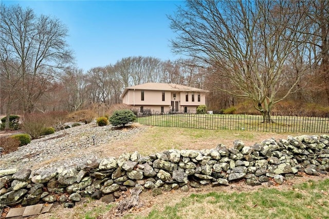 exterior space with a fenced front yard