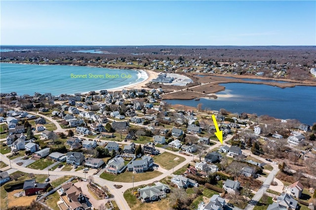 bird's eye view featuring a water view and a residential view
