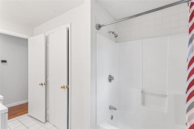 full bath featuring shower / tub combo, tile patterned flooring, and vanity