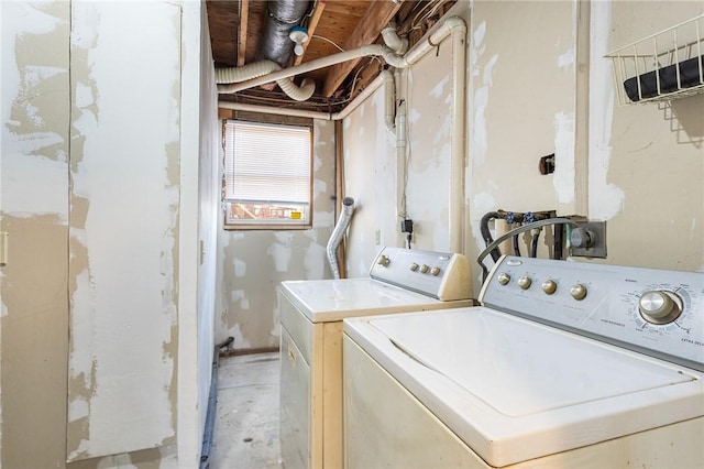 washroom with separate washer and dryer and laundry area