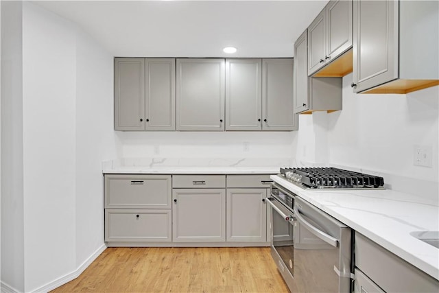 20 Holly Hill Ct, East Greenwich, RI 02818 - kitchen featuring light wood-style floors, gray cabinetry, and light stone counters
