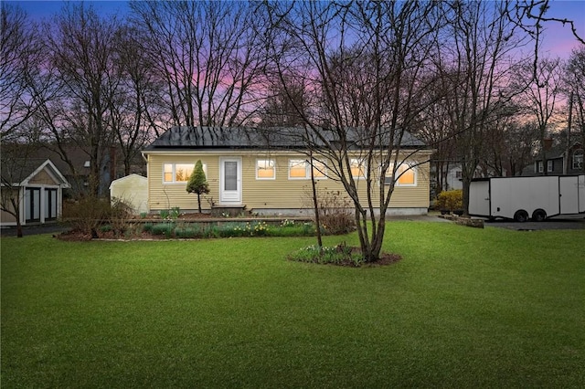 1737 Wampanoag Trl, Barrington, RI 02806 - view of front facade featuring a front lawn and an outdoor structure