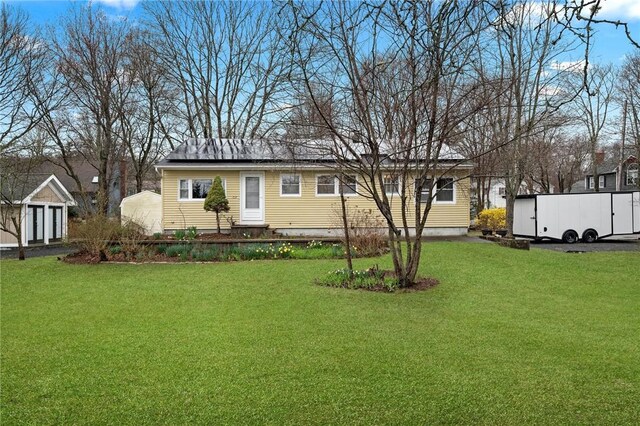 1737 Wampanoag Trl, Barrington, RI 02806 - back of house with a lawn