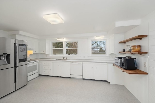 1737 Wampanoag Trl, Barrington, RI 02806 - kitchen featuring appliances with stainless steel finishes, a sink, light countertops, and white cabinetry