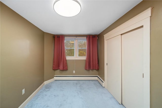 1737 Wampanoag Trl, Barrington, RI 02806 - unfurnished bedroom featuring light colored carpet, baseboard heating, baseboards, and a closet
