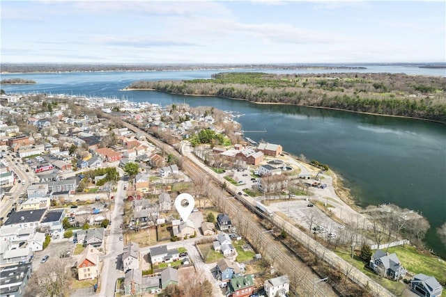 birds eye view of property with a water view and a residential view