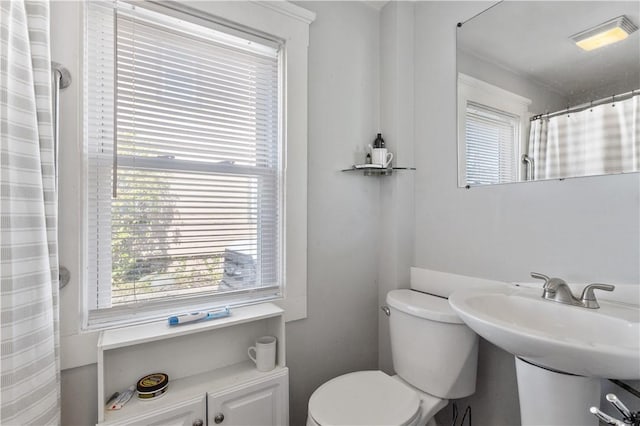 bathroom featuring visible vents, a healthy amount of sunlight, and toilet