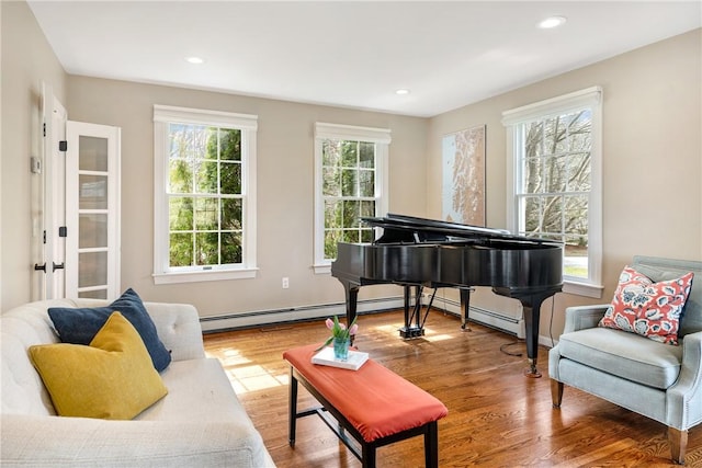 sitting room with wood finished floors and recessed lighting