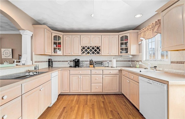 kitchen with recessed lighting, dishwasher, light brown cabinets, a sink, and black electric stovetop