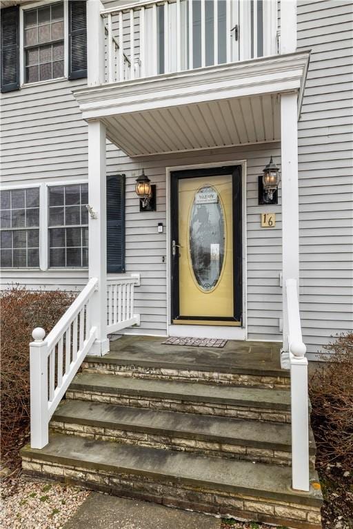 entrance to property with a balcony