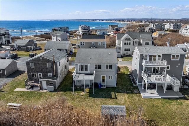 drone / aerial view featuring a residential view and a water view