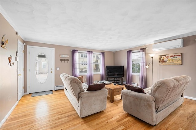 living room with light wood finished floors, baseboard heating, a wall mounted AC, and ornamental molding