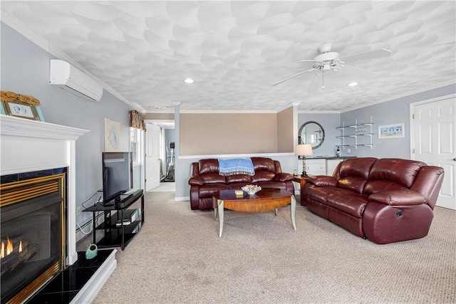 carpeted living room with recessed lighting, crown molding, a wall unit AC, and a lit fireplace