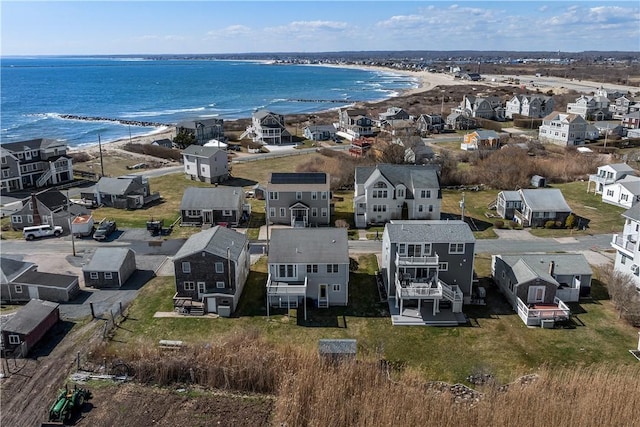 bird's eye view featuring a residential view, a view of the beach, and a water view