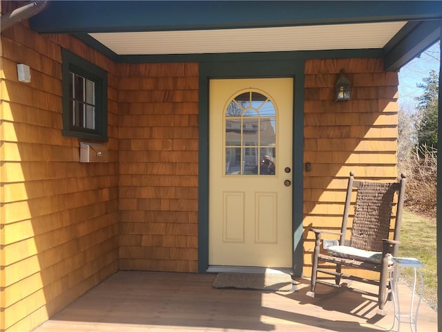 doorway to property featuring covered porch