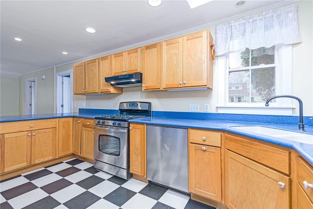 kitchen with recessed lighting, tile patterned floors, under cabinet range hood, stainless steel appliances, and a sink