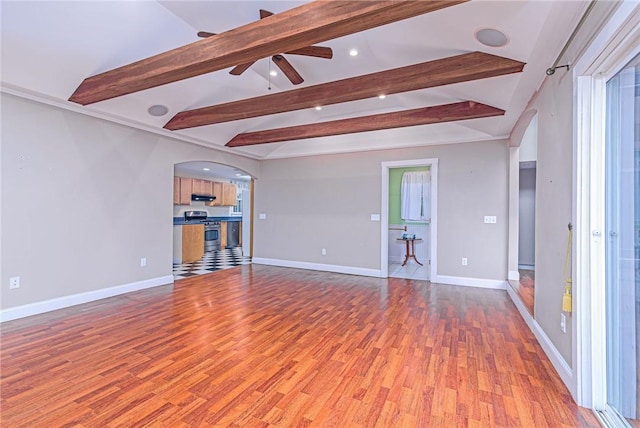 empty room featuring light wood-style flooring, arched walkways, baseboards, recessed lighting, and a ceiling fan