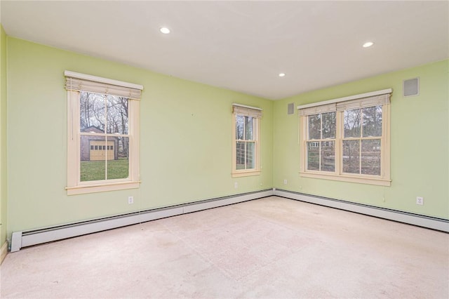 carpeted spare room featuring baseboards and recessed lighting
