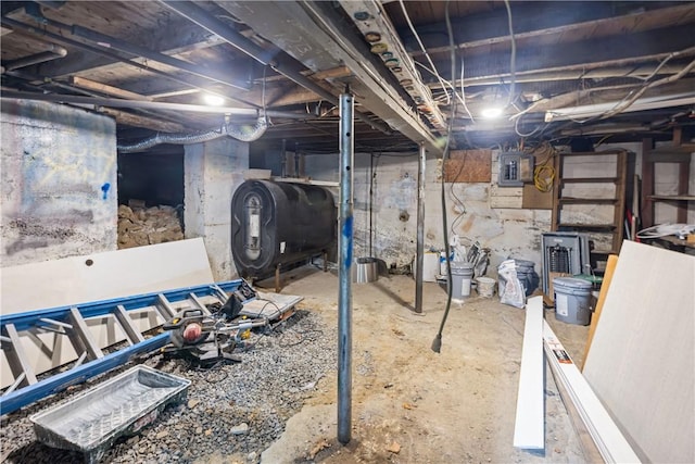 unfinished basement with heating fuel and electric panel