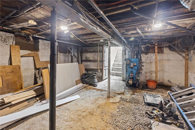 unfinished basement featuring stairway