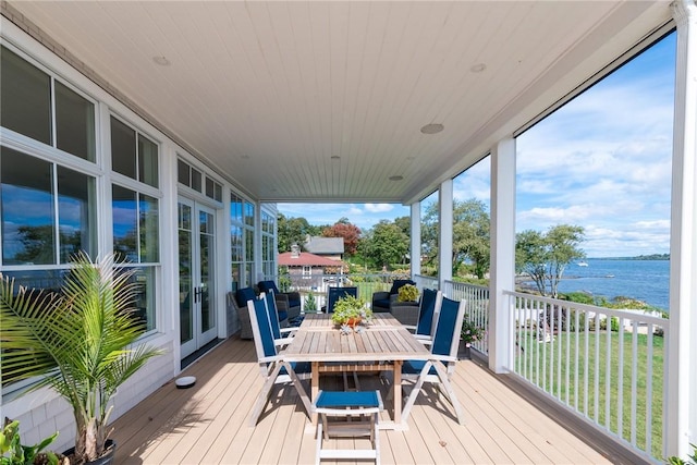 10 Coulter St, Jamestown, RI 02835 - wooden terrace featuring a water view and outdoor dining area
