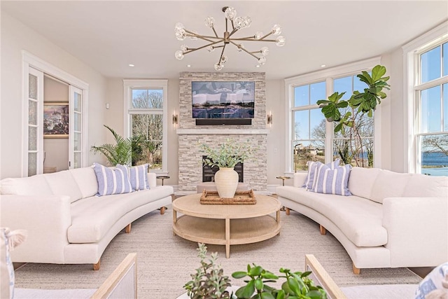 living area with a fireplace and plenty of natural light