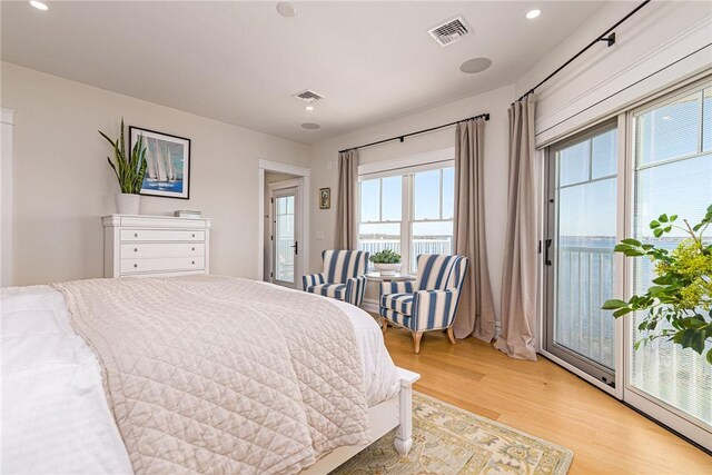 bedroom featuring recessed lighting, light wood-type flooring, and visible vents