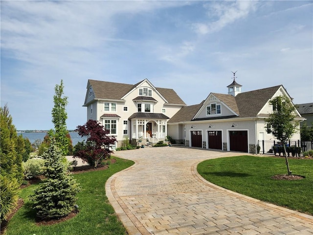 10 Coulter St, Jamestown, RI 02835 - view of front of property featuring a garage and decorative driveway