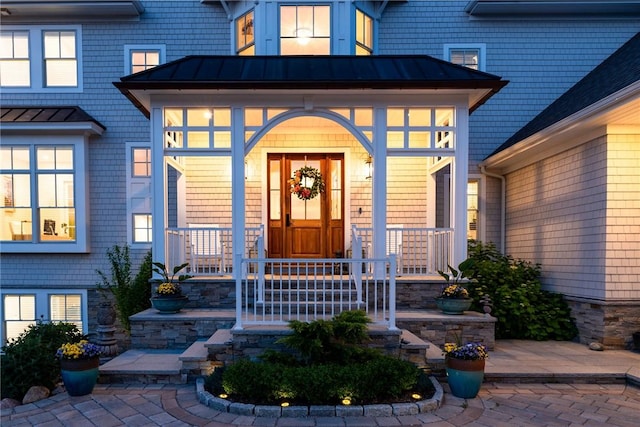 10 Coulter St, Jamestown, RI 02835 - entrance to property featuring a porch, a standing seam roof, and a metal roof