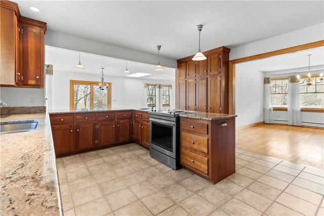 200 Pond St, South Kingstown, RI 02879 - kitchen featuring stainless steel electric range oven, a sink, an inviting chandelier, and a wealth of natural light