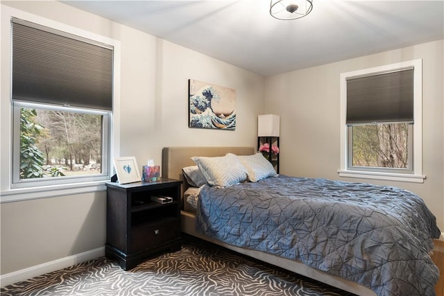 bedroom with carpet and baseboards