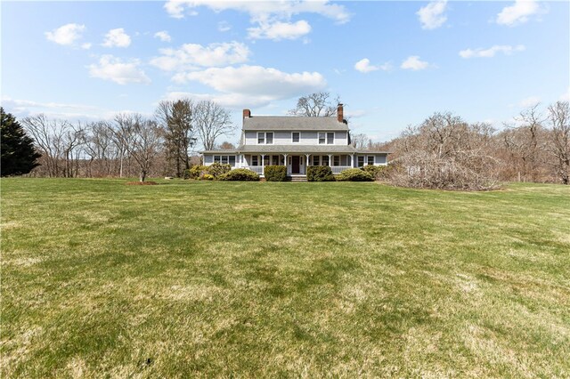 200 Pond St, South Kingstown, RI 02879 - view of front of property featuring a porch, a chimney, and a front lawn