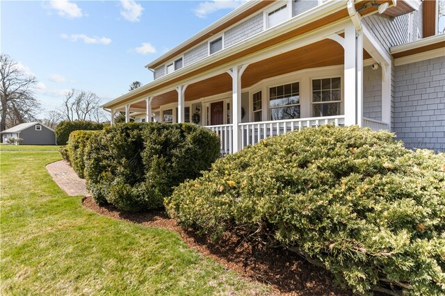 200 Pond St, South Kingstown, RI 02879 - view of side of property featuring a yard and covered porch