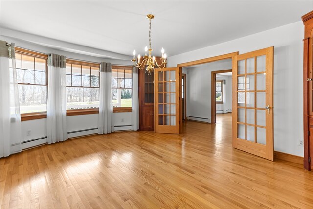 200 Pond St, South Kingstown, RI 02879 - unfurnished dining area with light wood-type flooring, a baseboard heating unit, a chandelier, plenty of natural light, and french doors