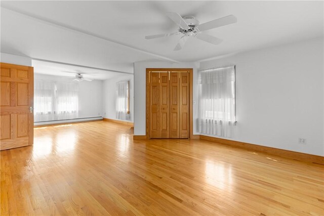 200 Pond St, South Kingstown, RI 02879 - interior space featuring baseboard heating, light wood-type flooring, baseboards, and a ceiling fan