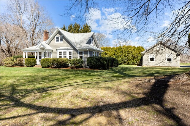 200 Pond St, South Kingstown, RI 02879 - view of side of home with a chimney and a lawn