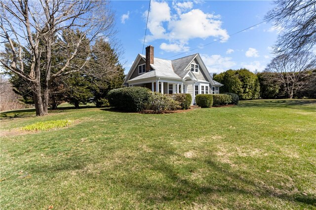 200 Pond St, South Kingstown, RI 02879 - view of side of property with a lawn and a chimney