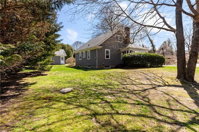 200 Pond St, South Kingstown, RI 02879 - rear view of house with a yard and a chimney