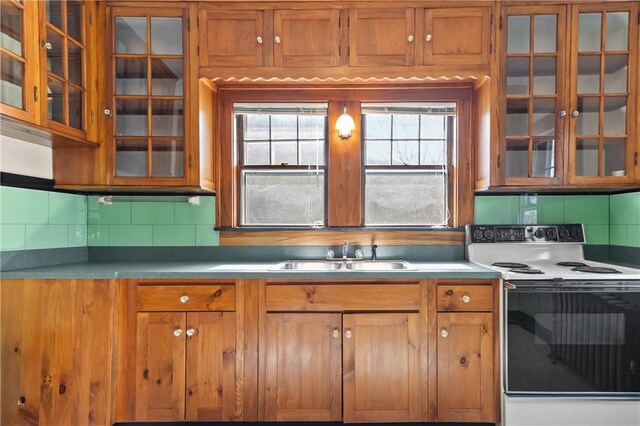 200 Pond St, South Kingstown, RI 02879 - kitchen with a sink, a healthy amount of sunlight, electric range oven, and brown cabinets