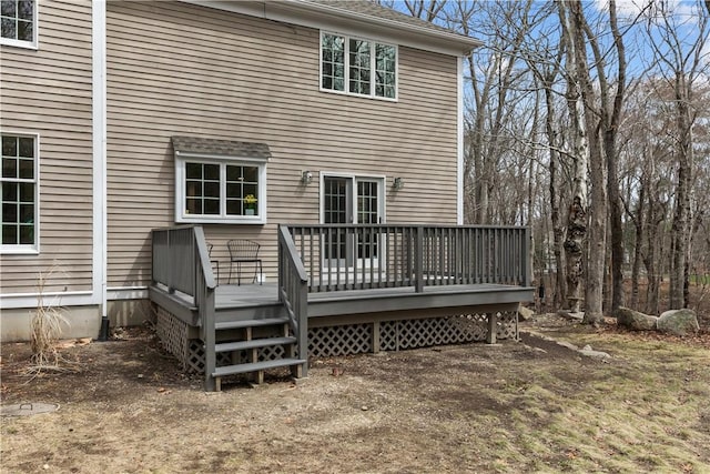 rear view of house with a wooden deck